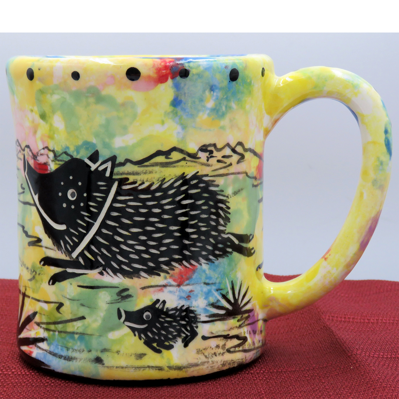 Mana Pottery e-mug featuring Javelina and baby on desert landscape on confetti