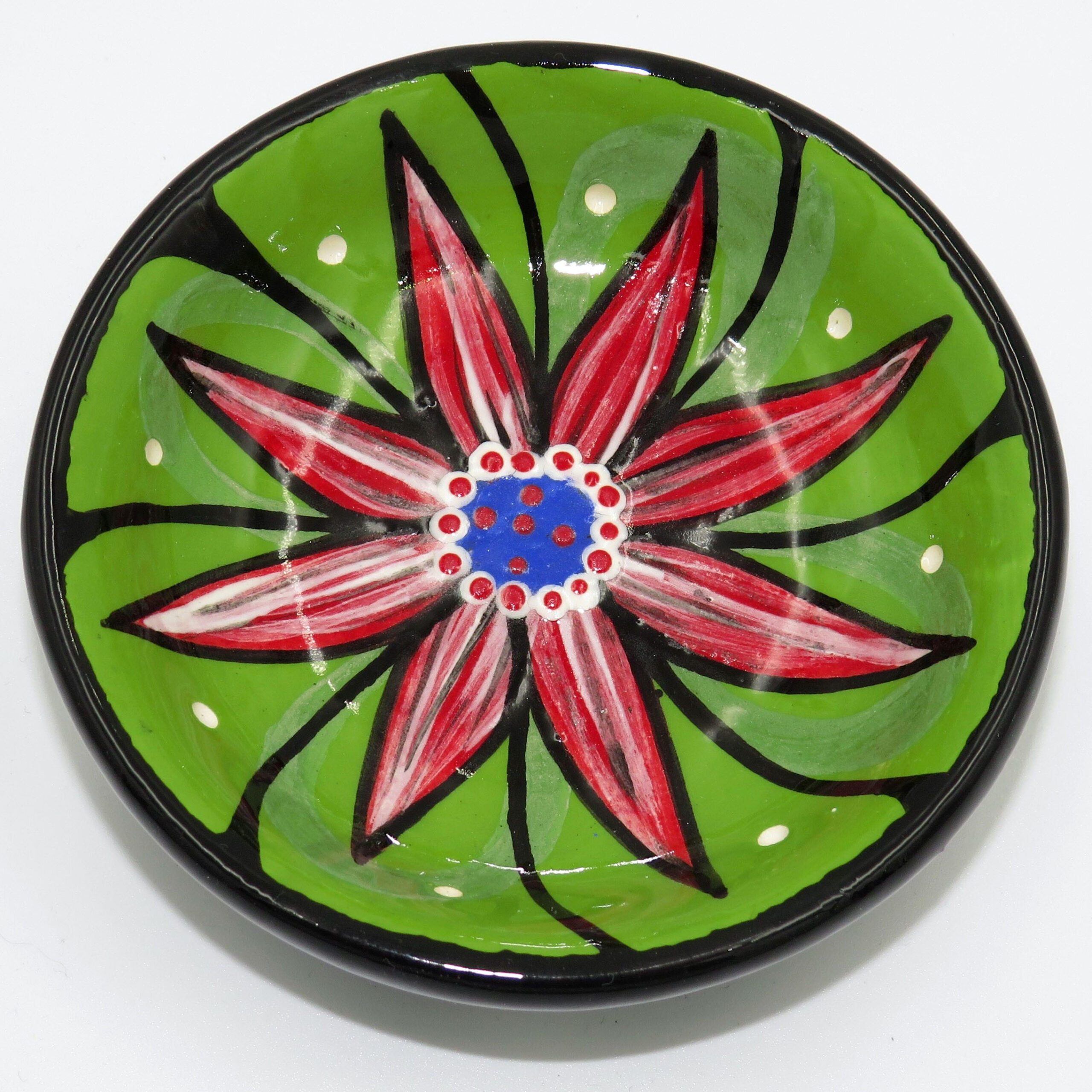 Mana Pottery teabag holder featuring Peyote in bloom and black & white marbled underside