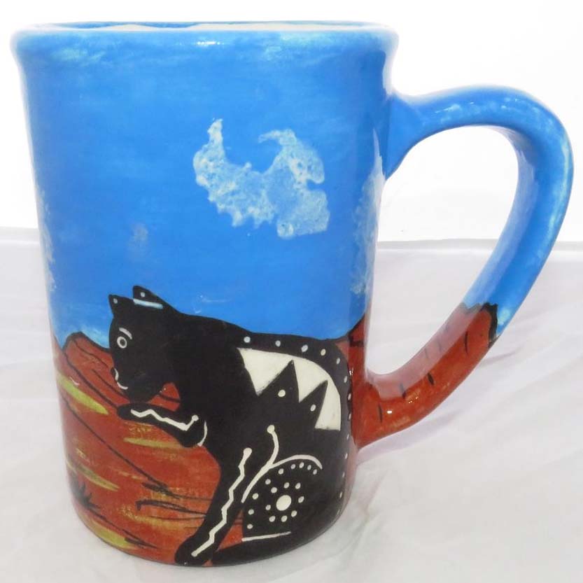 Image of Mana Pottery large mug featuring cat and hawk against desert earth and sky.