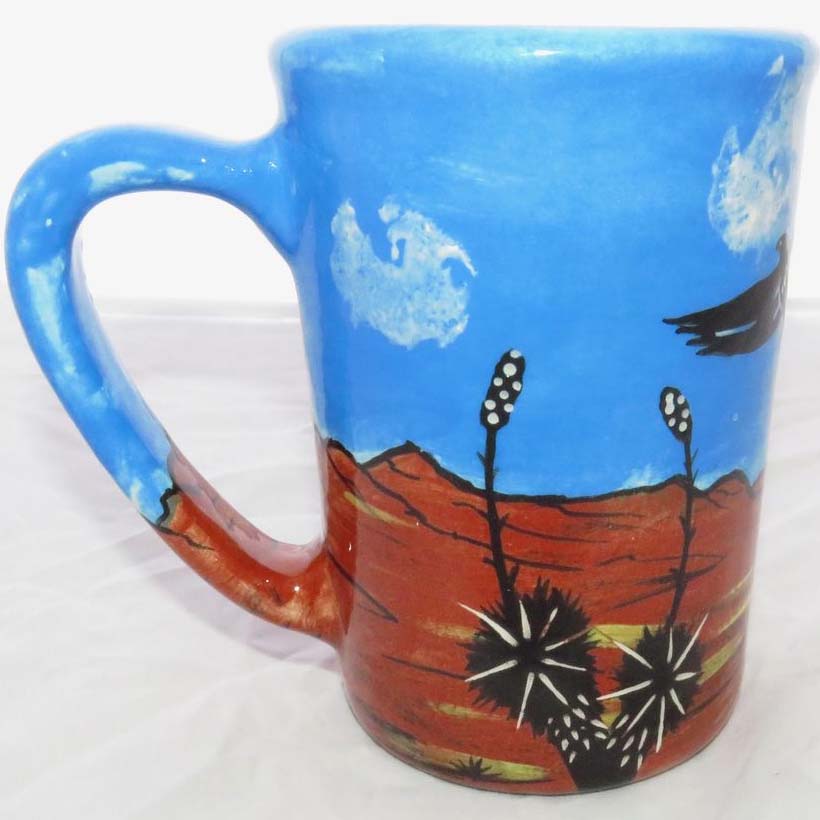 Image of Mana Pottery large mug featuring cat and hawk against desert earth and sky.