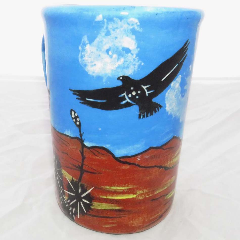Image of Mana Pottery large mug featuring cat and hawk against desert earth and sky.