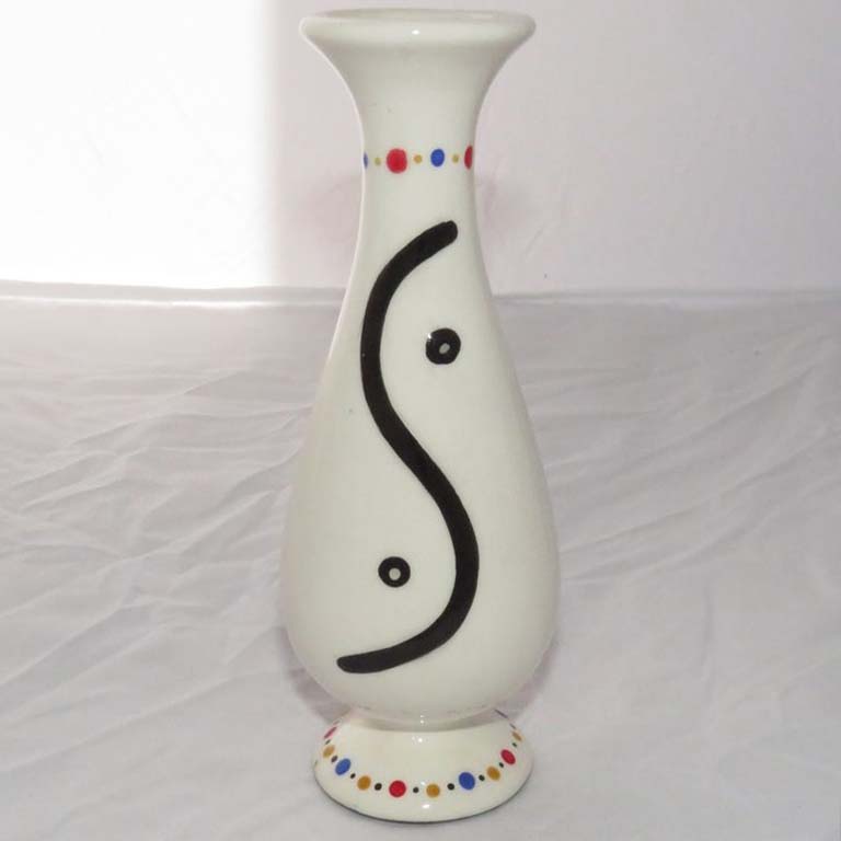Image of Mana Pottery curved bud vase featuring Peyote button and S-curve on reverse sides, on creamy white.