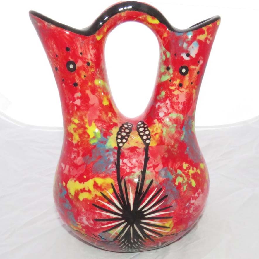 Image of Mana Pottery Medium Wedding Vase featuring kissing hummingbirds with desert vegetation on reverse, on ruby background.