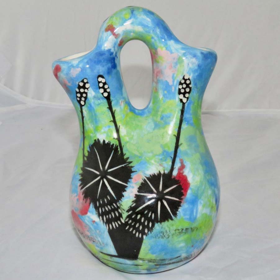 Image of Mana Pottery Tiny Wedding Vase featuring kitty with desert plants on reverse, on turquoise blue background. Reverse side.