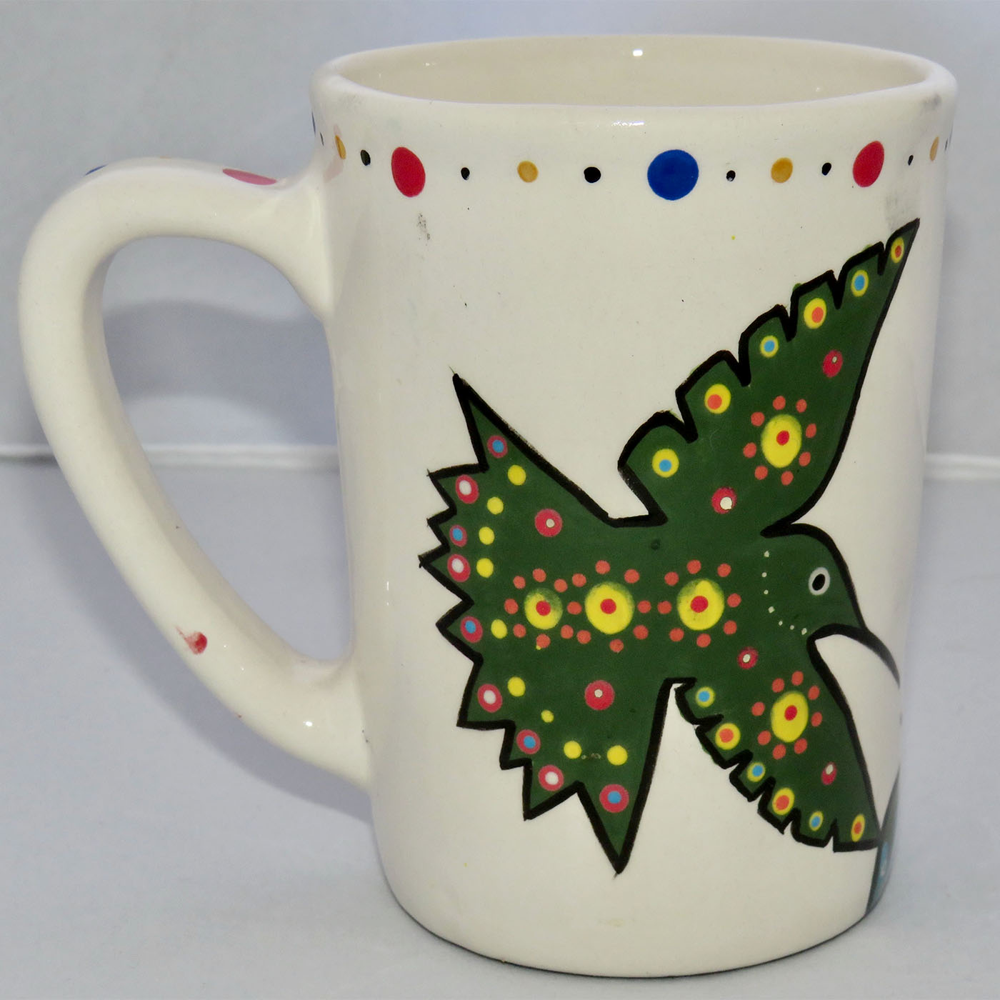 Image of Mana Pottery Large Mug featuring two hummingbirds sipping a Peyote blossom, one coral and one green.