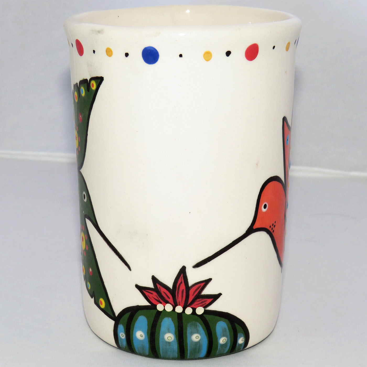 Image of Mana Pottery Large Mug featuring two hummingbirds sipping a Peyote blossom, one coral and one green.