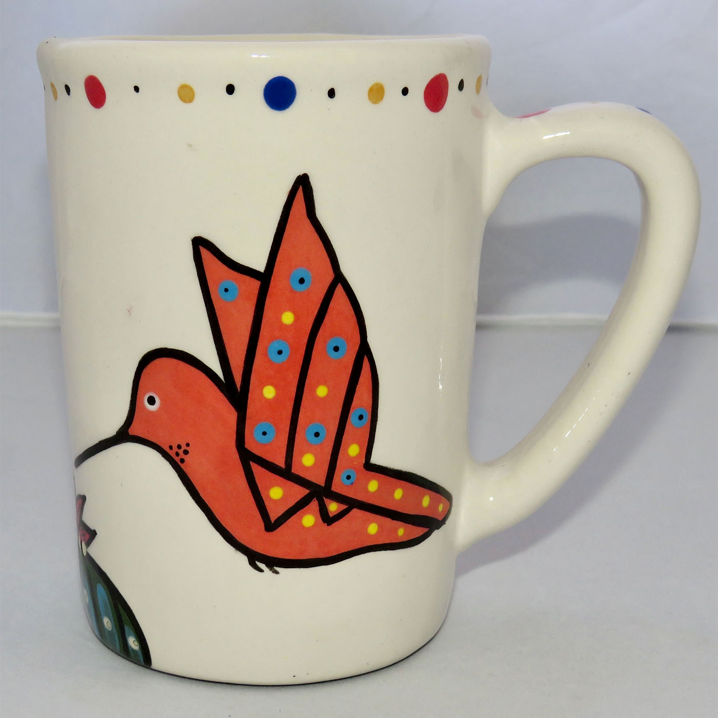 Image of Mana Pottery Large Mug featuring two hummingbirds sipping a Peyote blossom, one coral and one green.