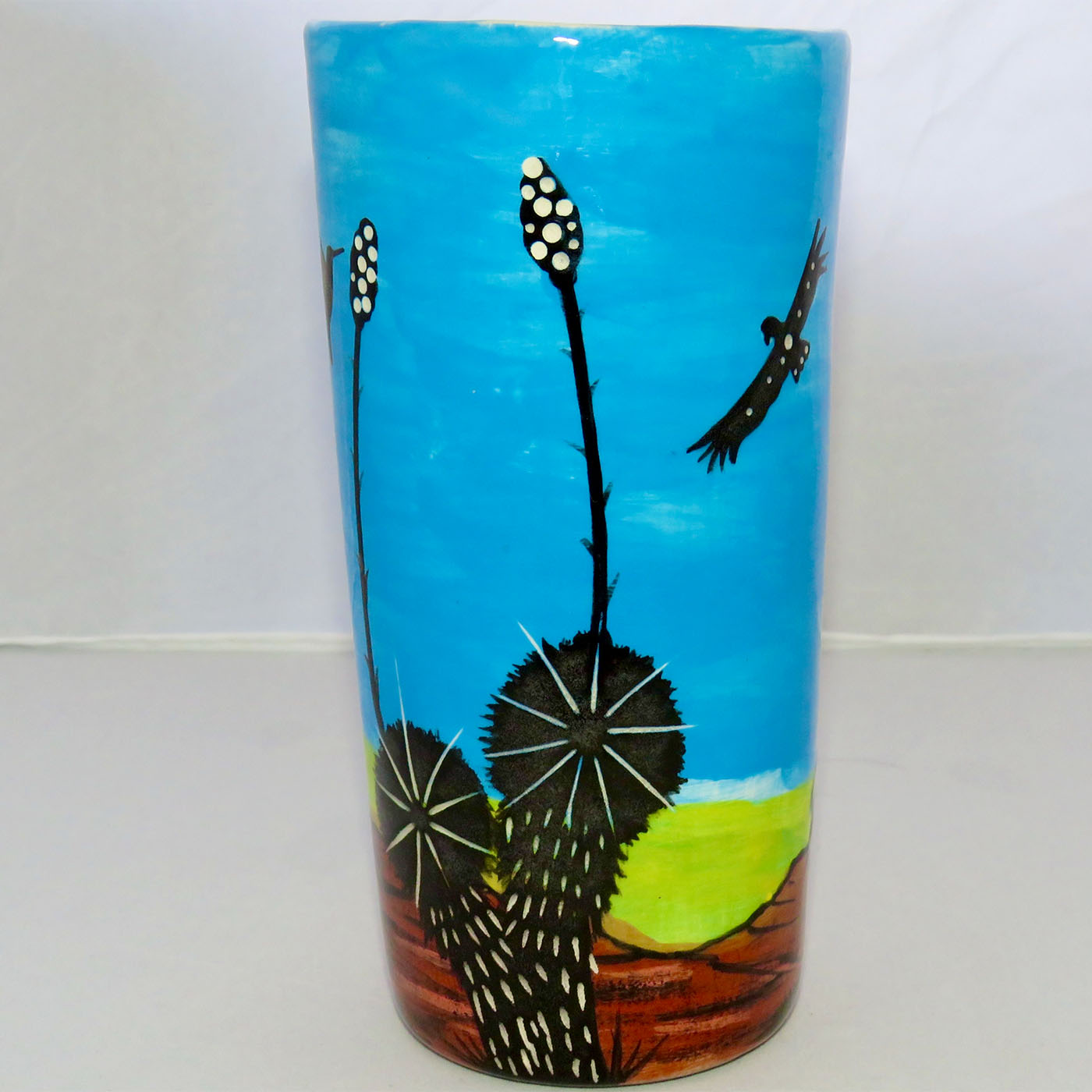 Image of Mana Pottery tumbler/vase featuring Chakra Being on Earth and sky.