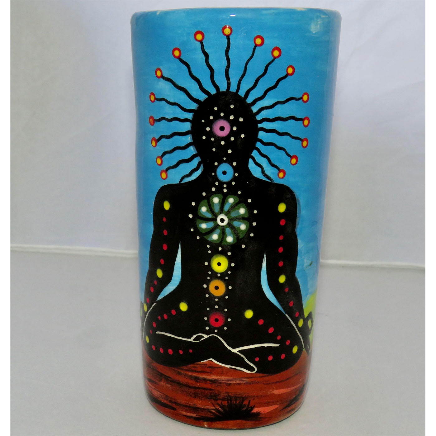 Image of Mana Pottery tumbler/vase featuring Chakra Being on Earth and sky.