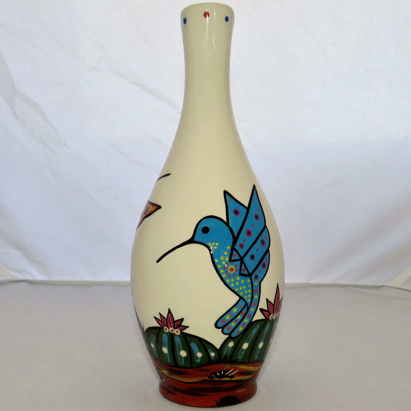Image of Mana Pottery Tall Rose Vase featuring hummingbirds of different colors.