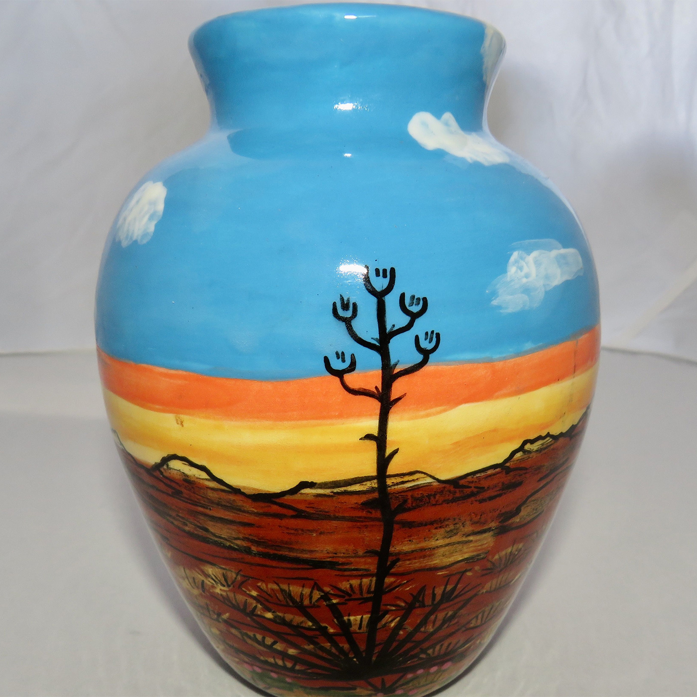 Mana Pottery Six Inch Vase featuring bear against desert earth and sky at glorious cusp of day.