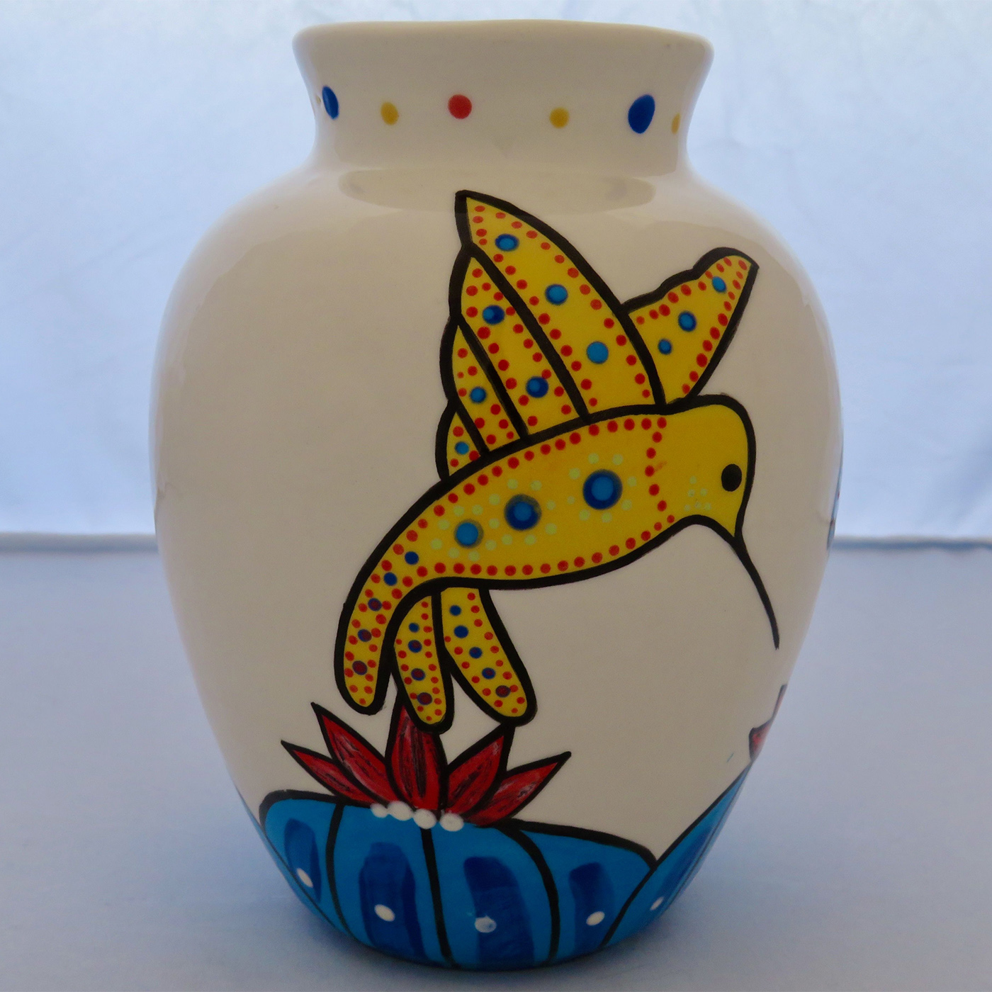 Mana Pottery Six Inch Vase featuring blue and red hummingbirds sipping from the blossoms of blue peyote