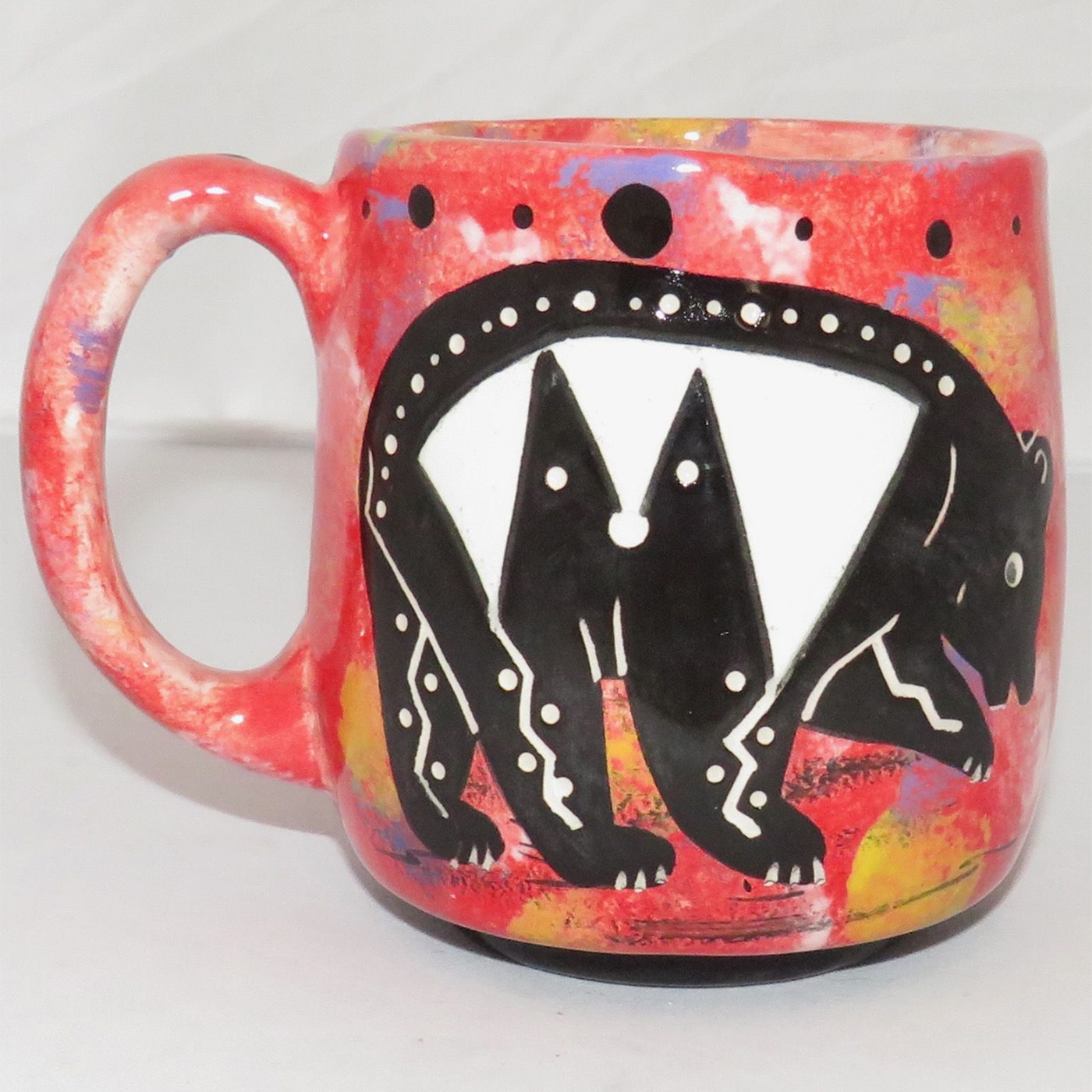 Mana Pottery Country Cup with bear and desert vegetation on reverse sides on a rose background