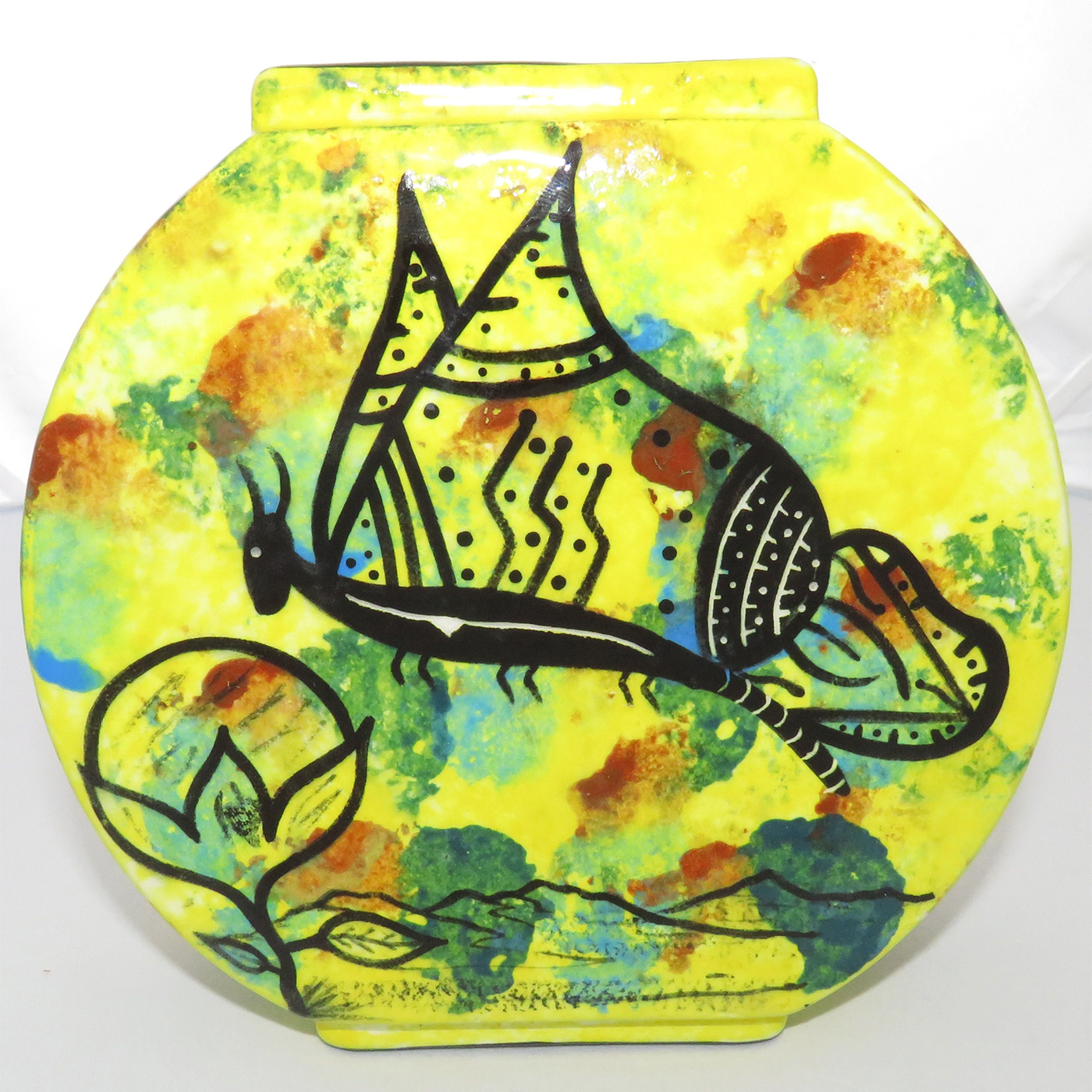 Mana Pottery Pillow Vase with hummingbirds and butterfly on reverse sides on a bright yellow background