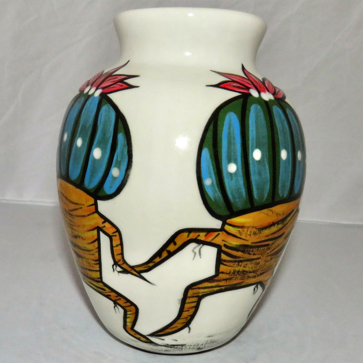 Mana Pottery 6-inch vase featuring Peyote duo on one side and desert vegetation on the reverse