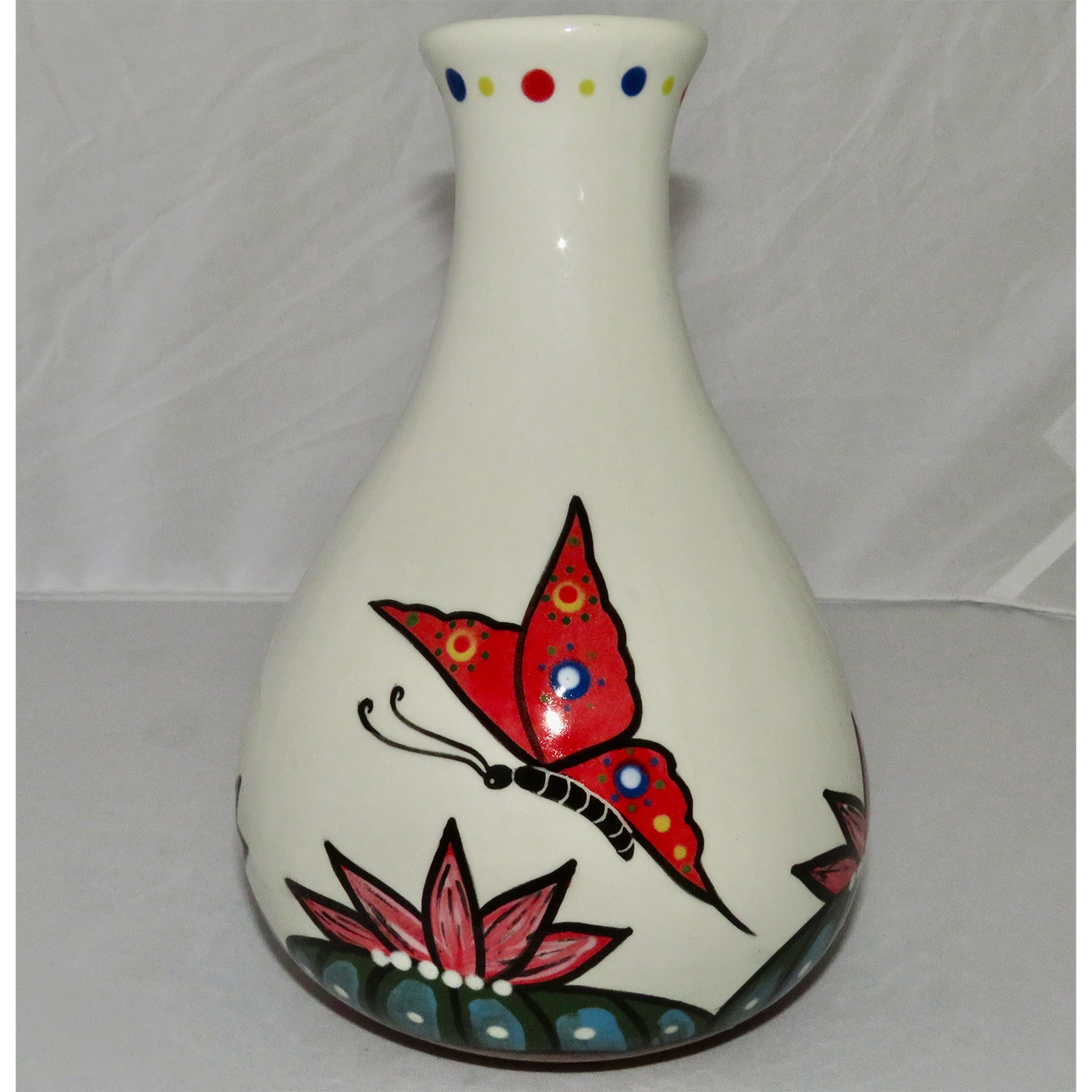 Mana Pottery Teardrop Vase featuring a dragonfly and two butterflies hovering over blossoming Peyote