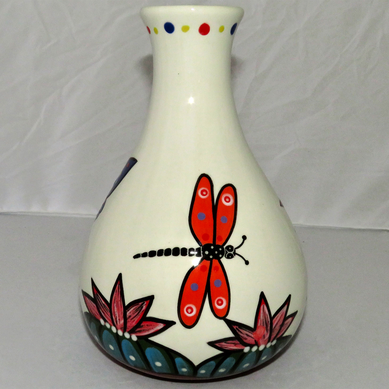Mana Pottery Teardrop Vase featuring a dragonfly and two butterflies hovering over blossoming Peyote