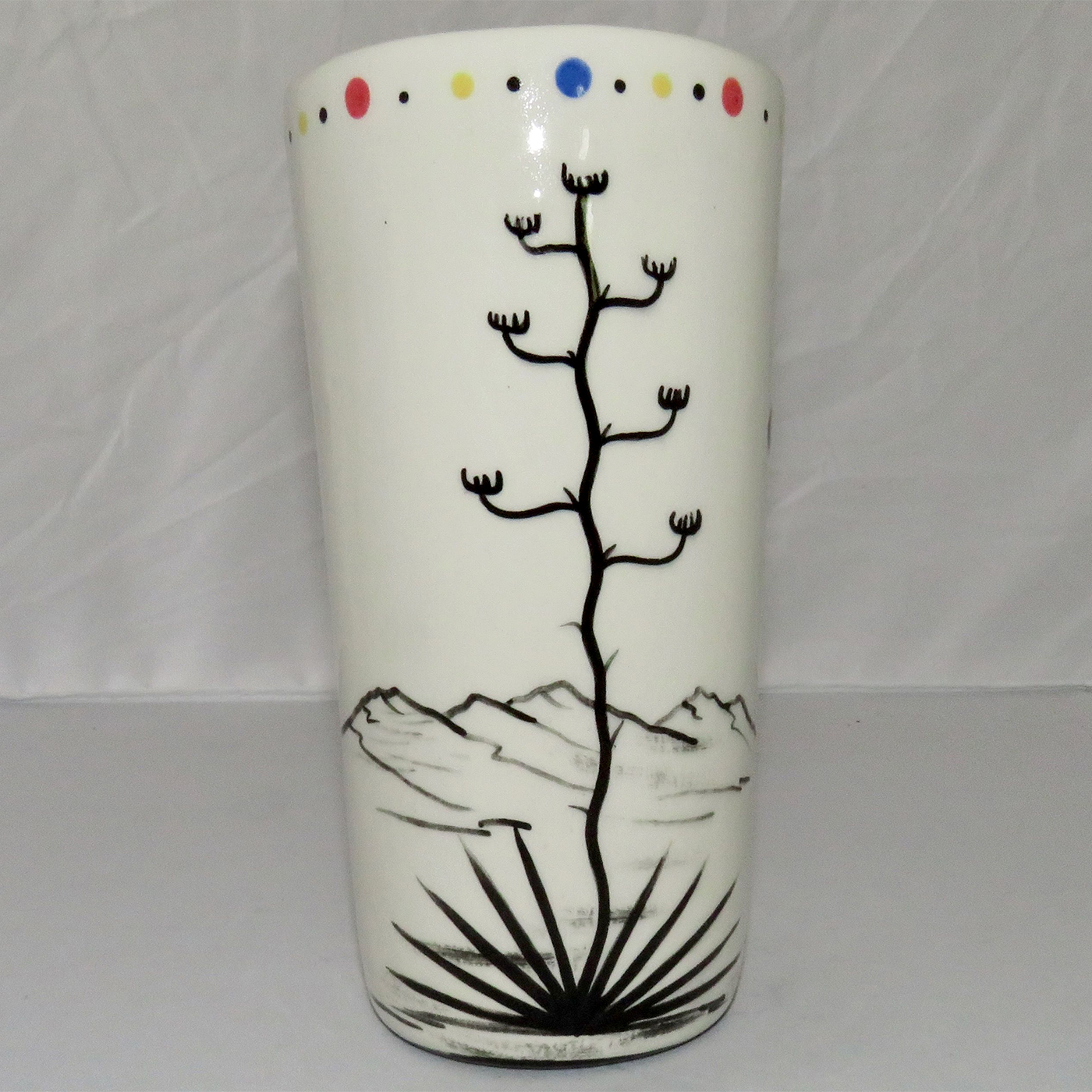 Mana Pottery tall tumbler featuring brown kitty with desert veg on reverse