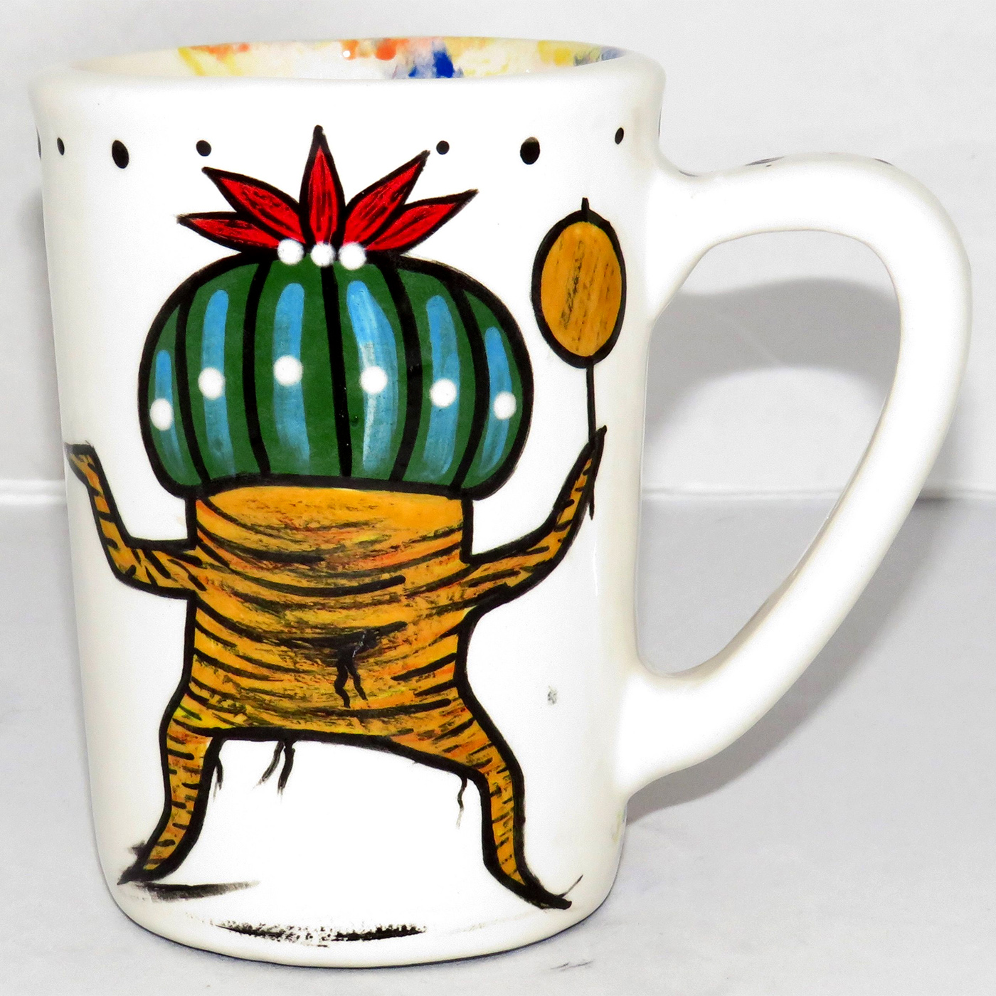 Mana Pottery large mug featuring Dancing Peyote with green top on one side and Aravaipa desert scene on reverse