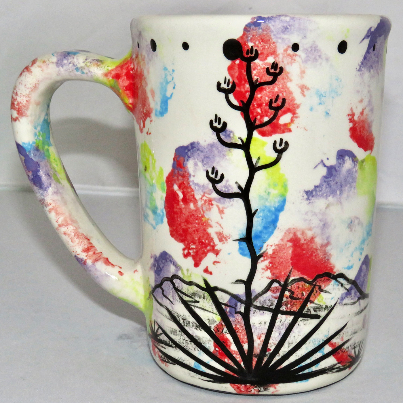 Mana Pottery large mug featuring colorful Peyote Guardian Spirit on one side and Aravaipa desert scene on reverse