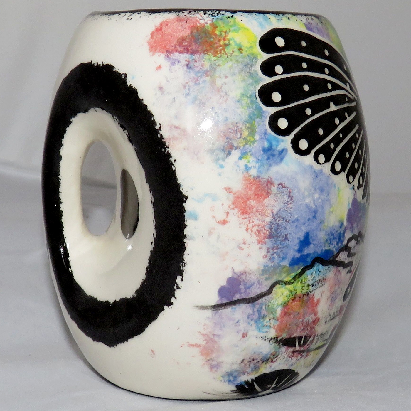 Mana Pottery Owl Mug. Owl face on handle side and owl in flight on opposite side. Side showing handle.
