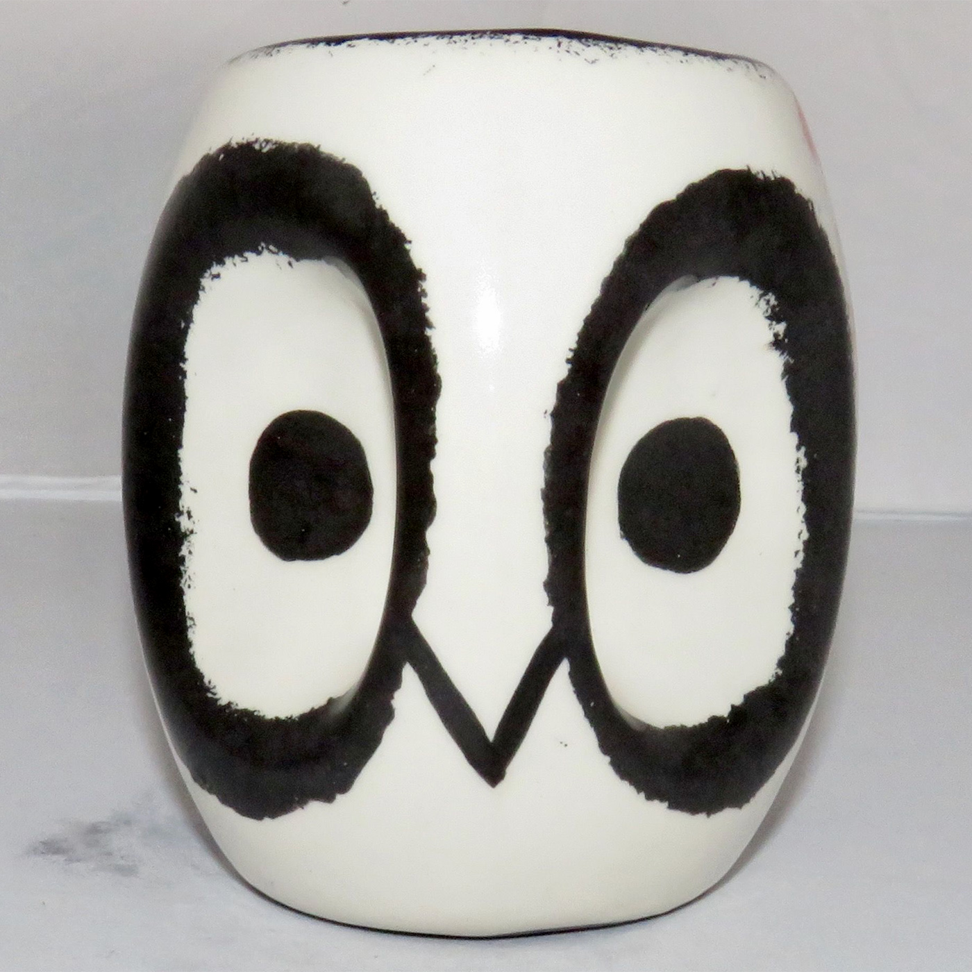 Mana Pottery Owl Mug. Owl face on handle side and owl in flight on opposite side.