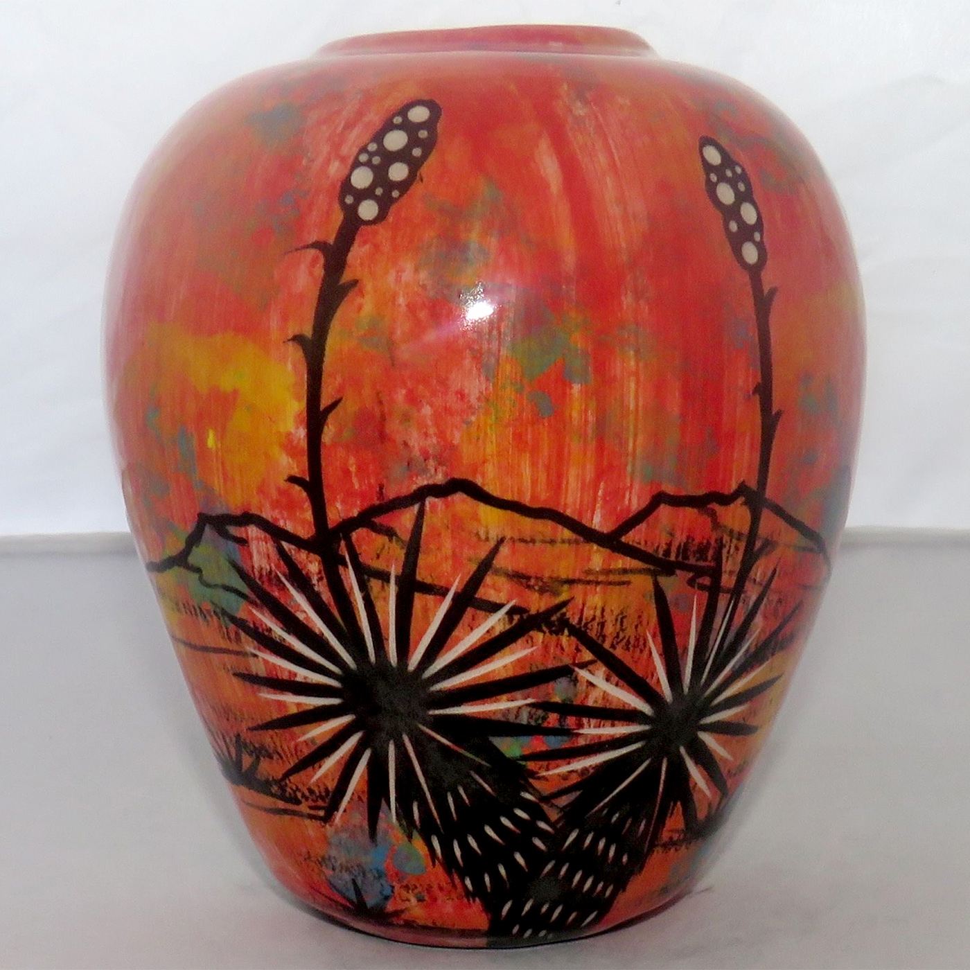 Mana Pottery 5-inch vase featuring Peyote Duo and flaming red desert, on reverse sides.