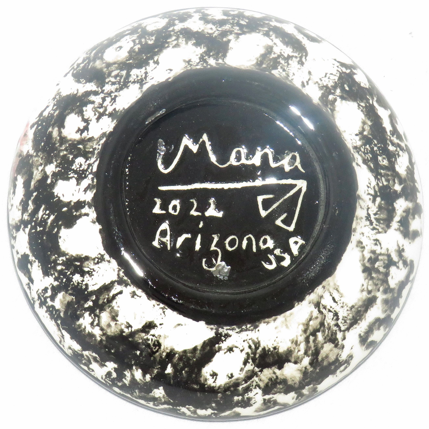 Mana Pottery Holy Bowl featuring butterfly on turquoise blue, and black and white marbled underside. In this image we see the underside.