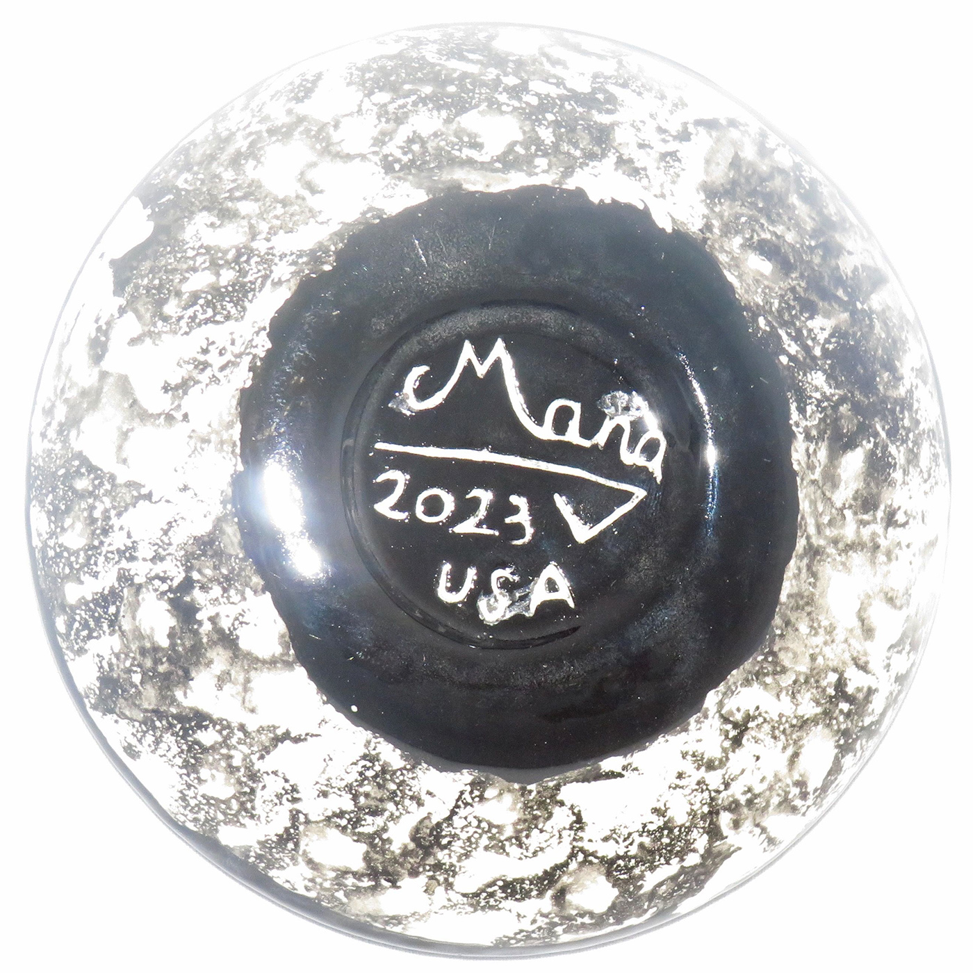 Mana Pottery Holy Bowl featuring blooming Peyote button against a white background, with black and white marbled underside. This view shows the underside.