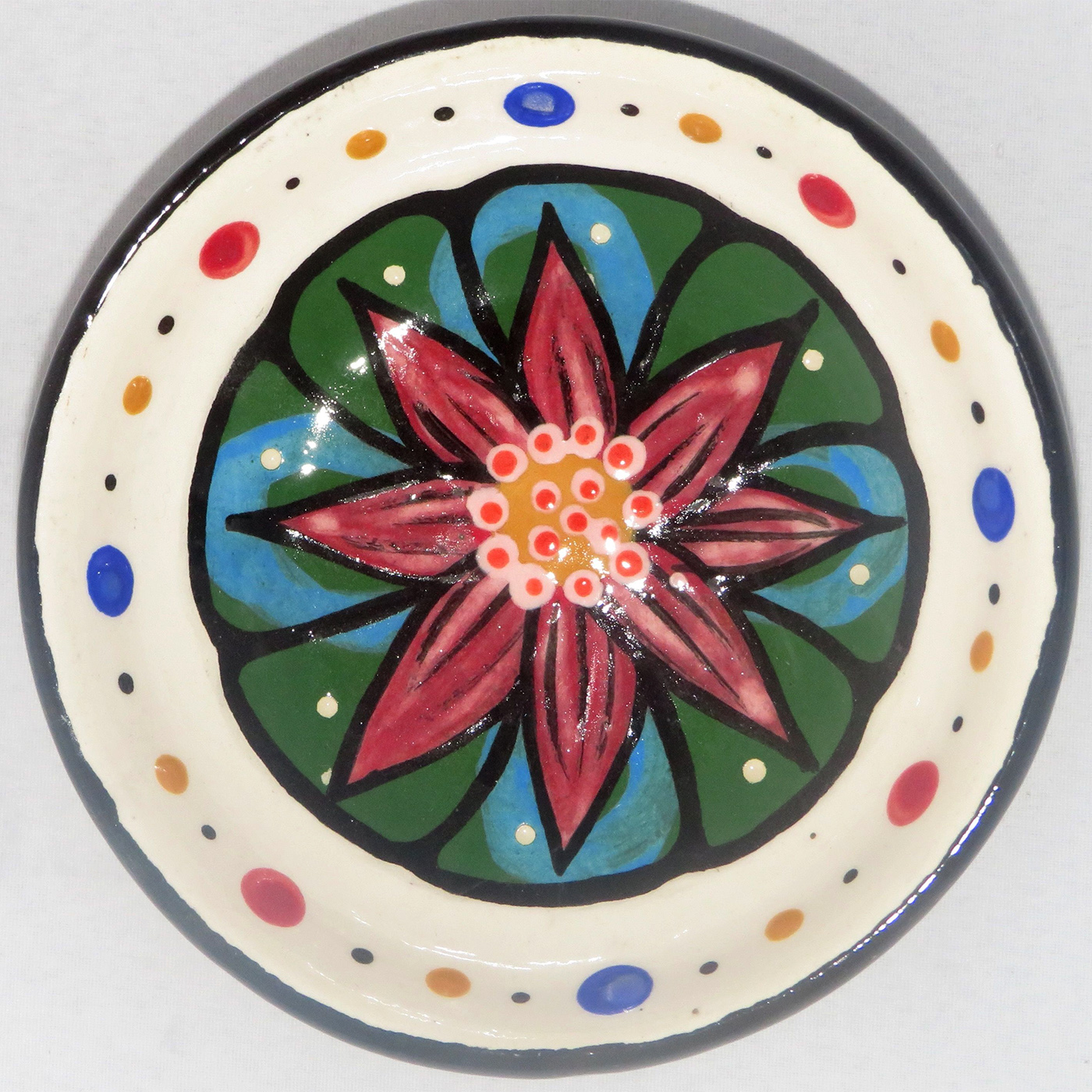 Mana Pottery Holy Bowl featuring blooming Peyote button against a white background, with black and white marbled underside.