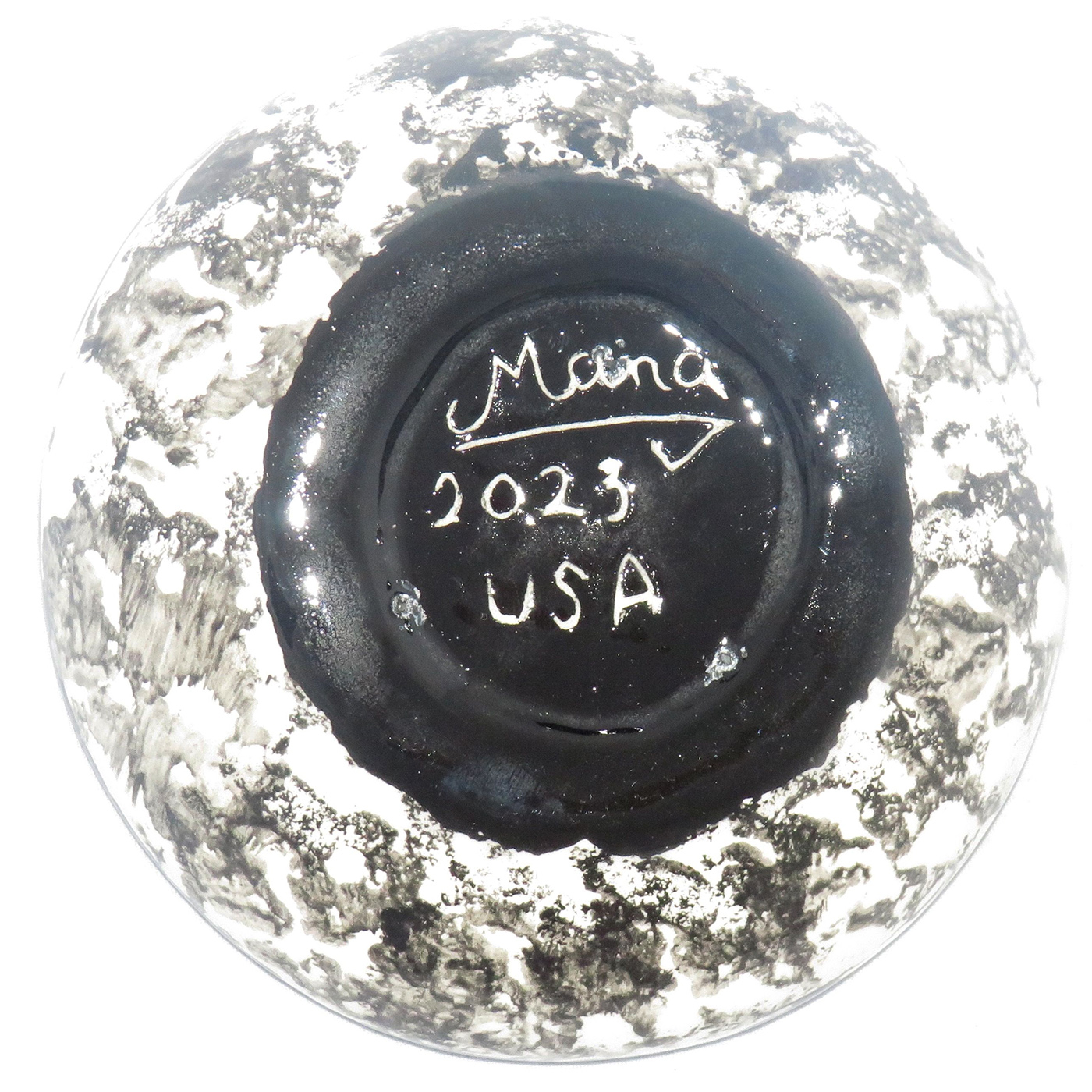 Mana Pottery Holy Bowl featuring blooming Peyote button against a white background, with black and white marbled underside. This view shows the underside.