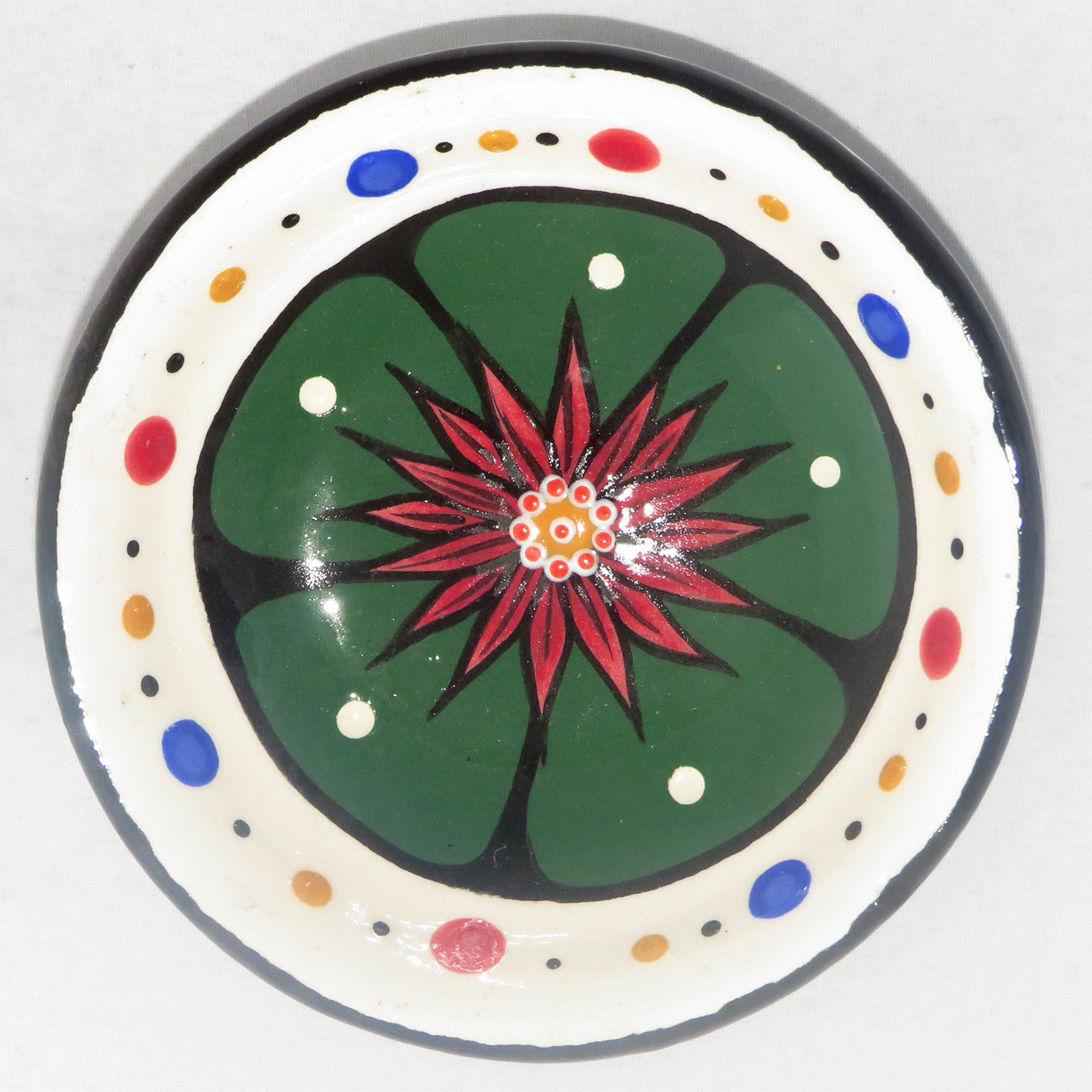 Mana Pottery Holy Bowl featuring blooming Peyote button against a white background, with black and white marbled underside.