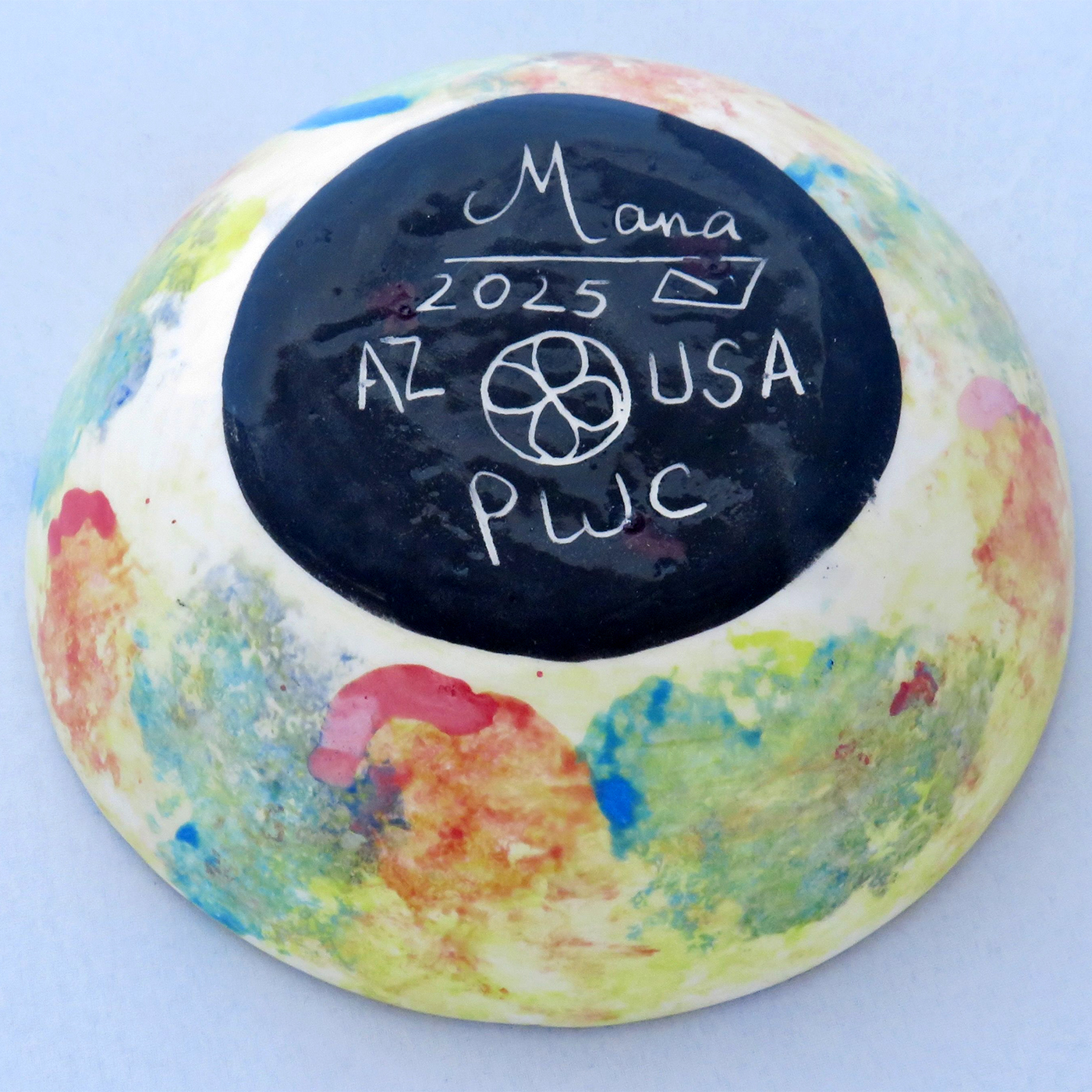 Mana Pottery Holy Bowl featuring Dancing Peyote on background accented with bright yellow, teal and scarlet. This is the underside view.