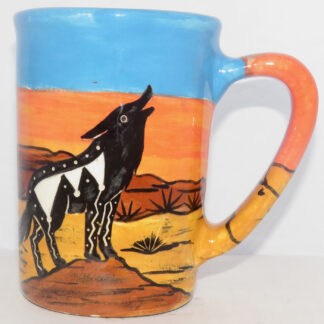 Mana Pottery large mug featuring howling coyote in desert scene.