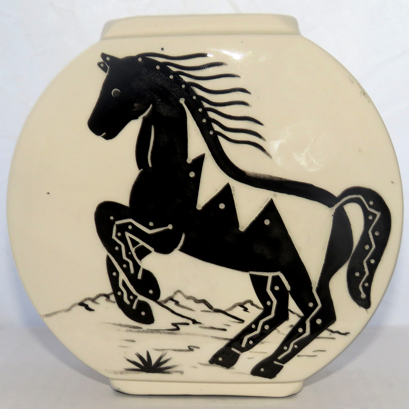 Mana Pottery Pillow Vase with horse in desert landscape in black and white.
