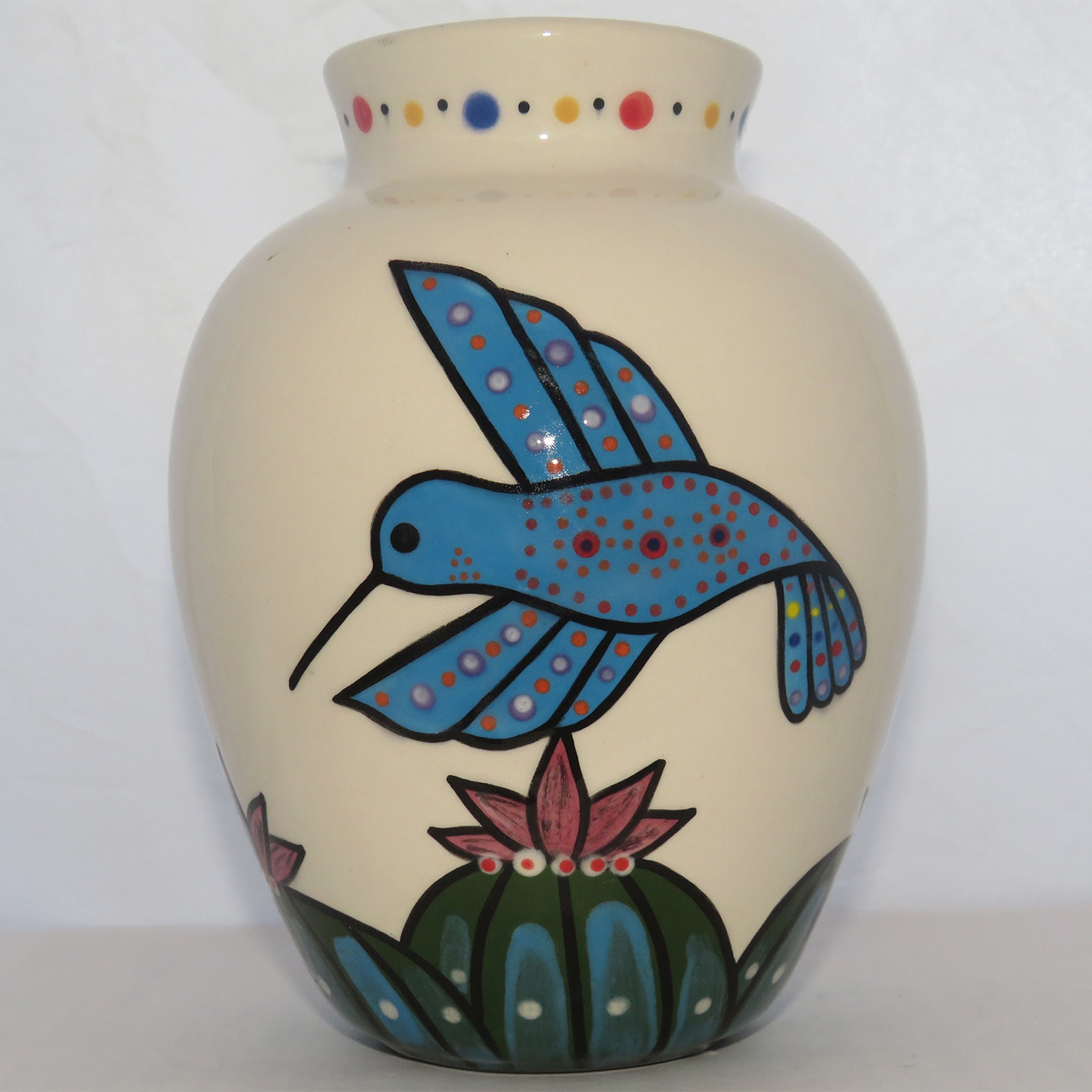 Mana Pottery Six Inch Vase featuring three colors of hummingbirds hovering above Peyote grove.
