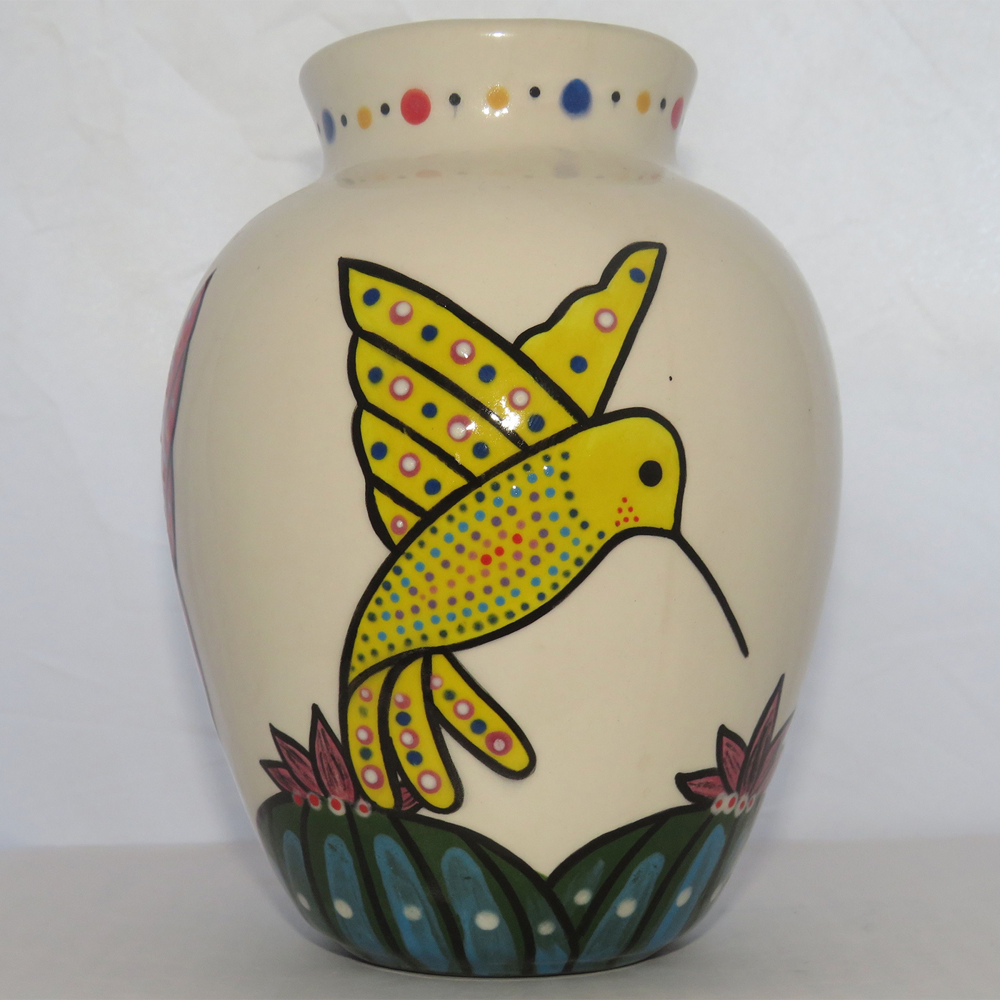 Mana Pottery Six Inch Vase featuring three colors of hummingbirds hovering above Peyote grove.