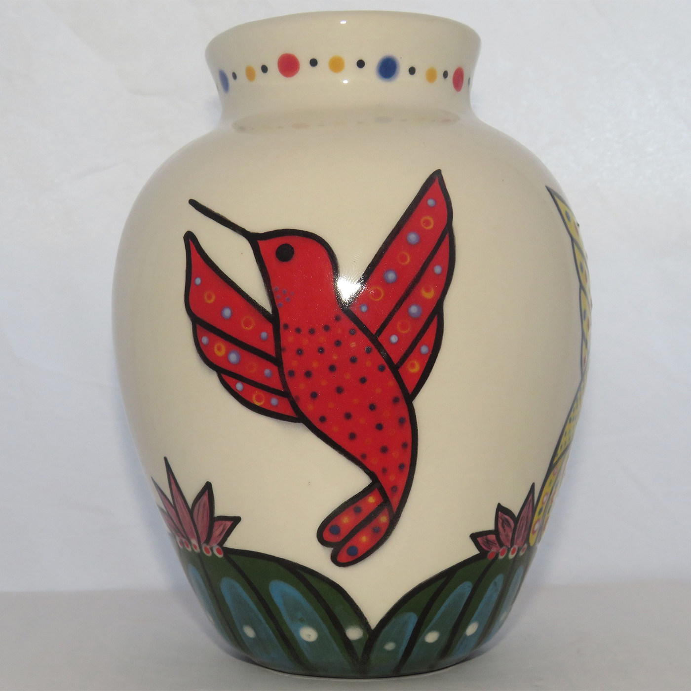 Mana Pottery Six Inch Vase featuring three colors of hummingbirds hovering above Peyote grove.