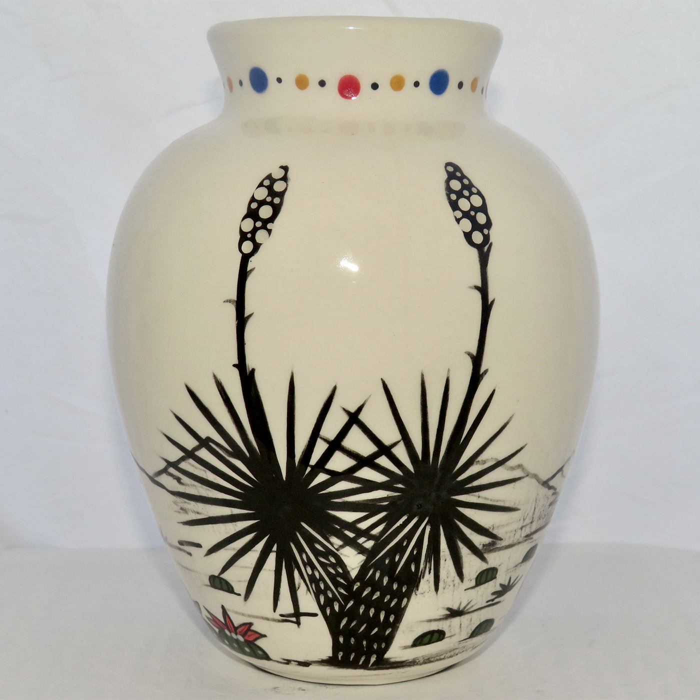 Mana Pottery Six Inch Vase featuring three colors of Spirit Walker in the desert.