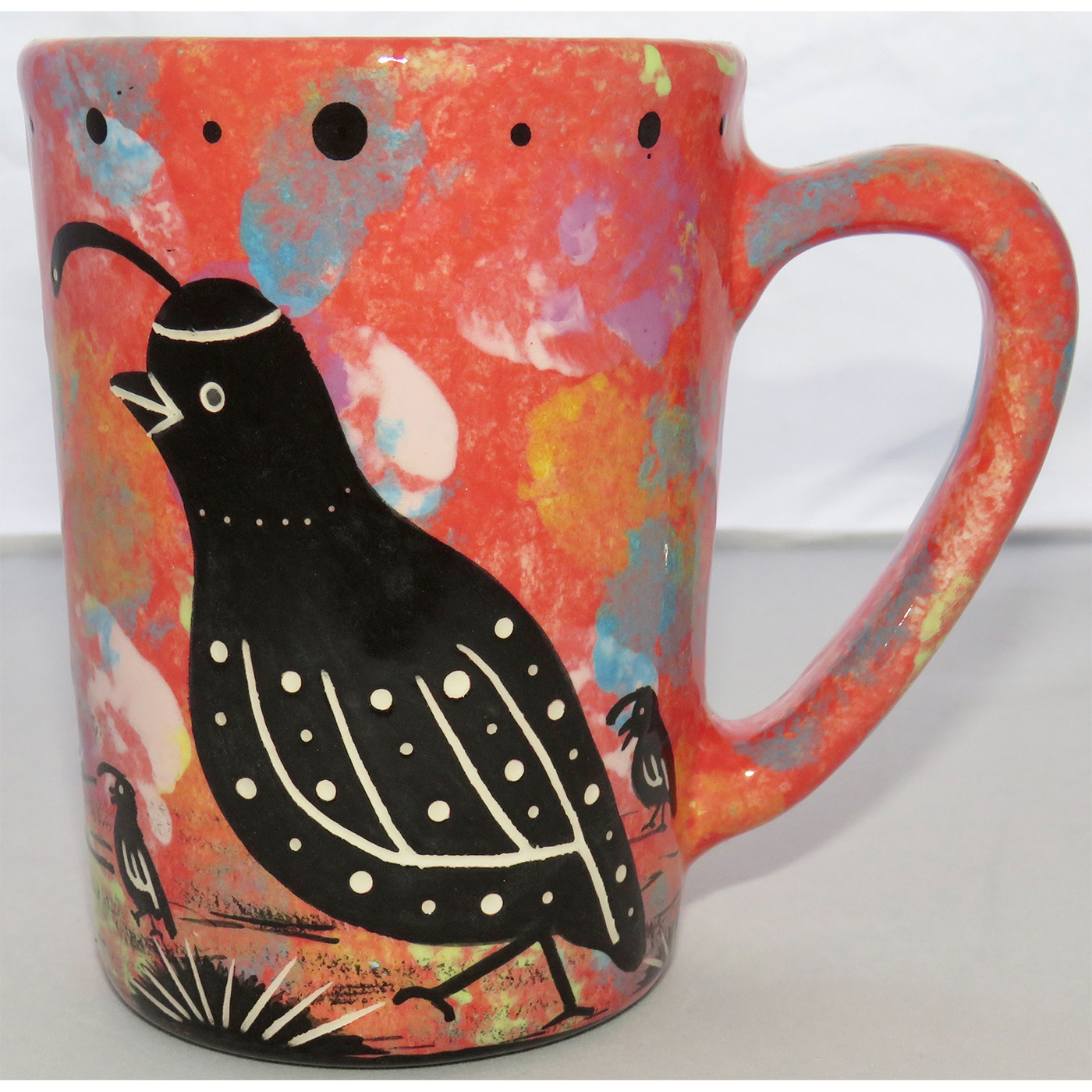 Photo of Mana Pottery Large Mug featuring quail family in desert on a rose background.