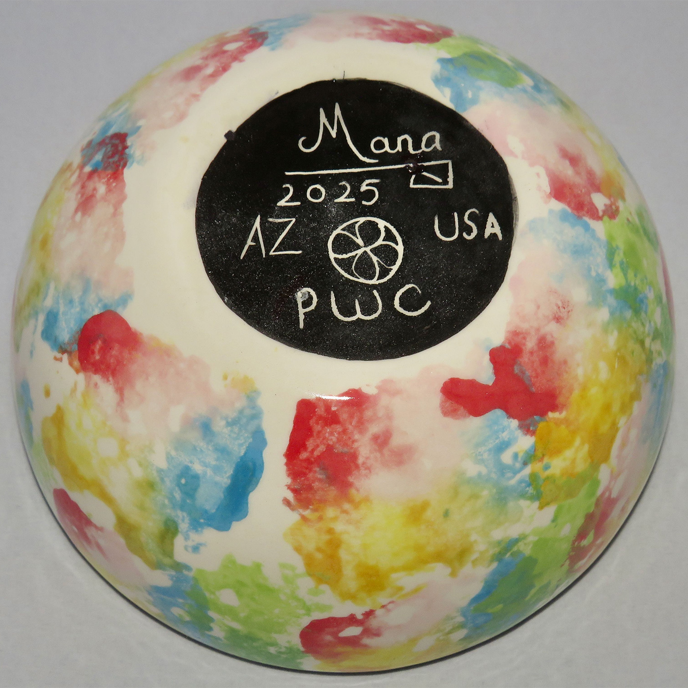 Photo of Mana Pottery Large Soup Bowl featuring butterfly on Peyote, with multicolored pattern on underside.