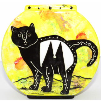 Photo of Mana Pottery Pillow Vase featuring kitty on one side and desert plants on reverse, on a bright yellow background.