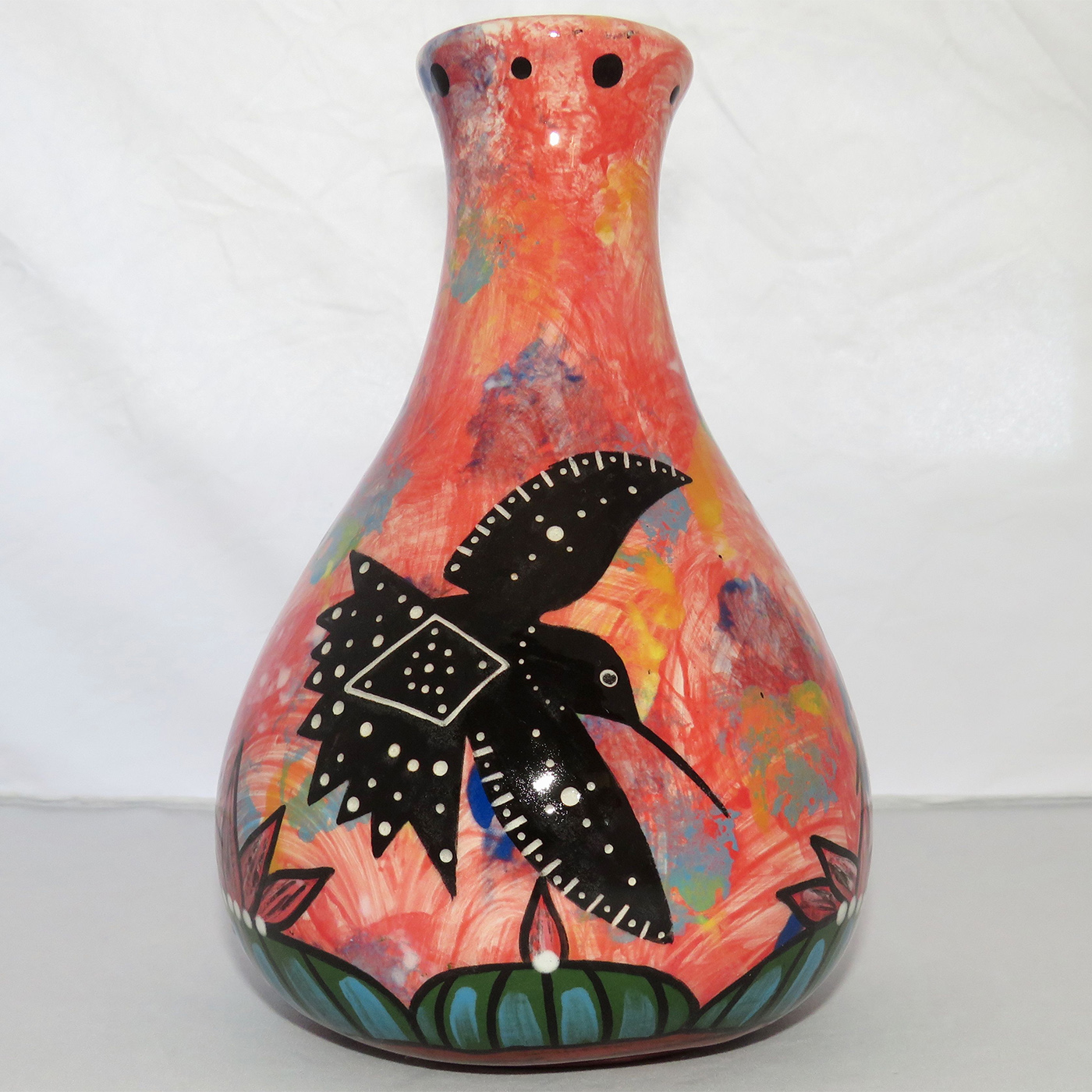 Photo of Mana Pottery Teardrop Vase featuring two hummingbirds and a butterfly over a Peyote grove, on a rose background.