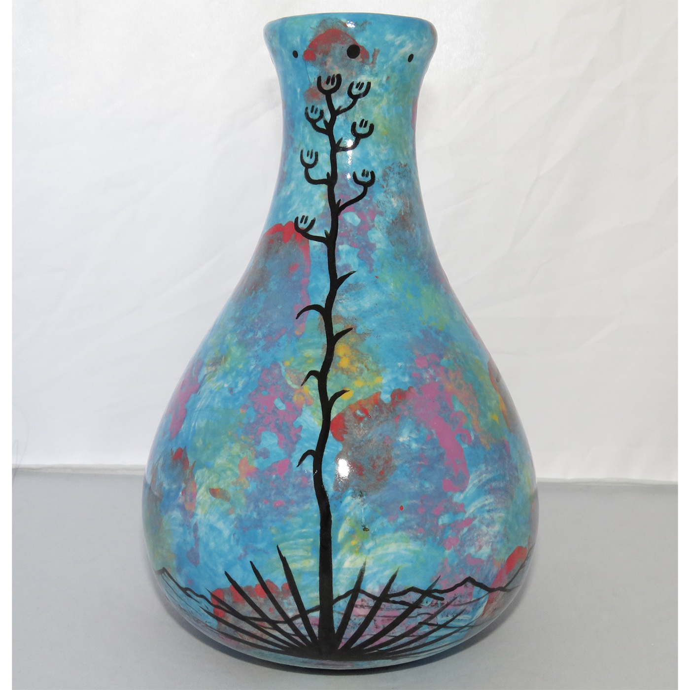 Photo of Mana Pottery Teardrop Vase featuring a hawk in flight high in the sky over the desert.
