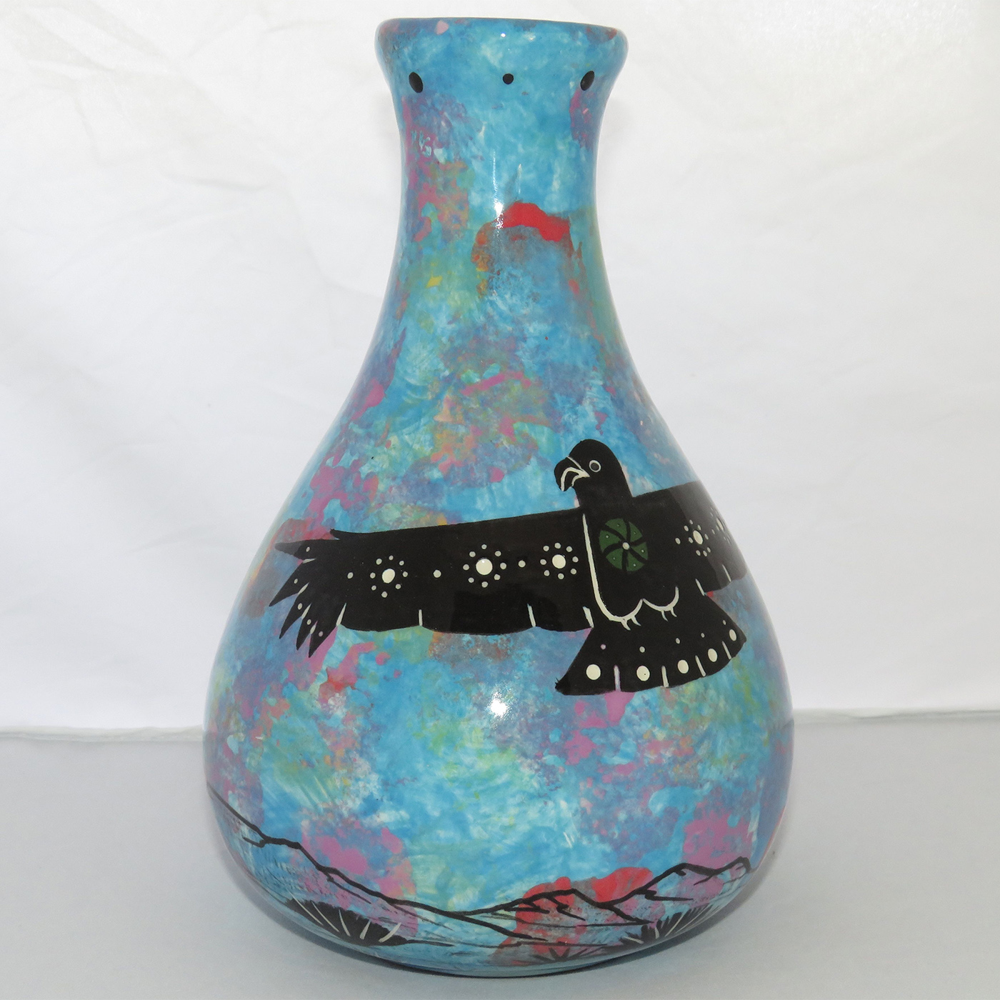 Photo of Mana Pottery Teardrop Vase featuring a hawk in flight high in the sky over the desert.