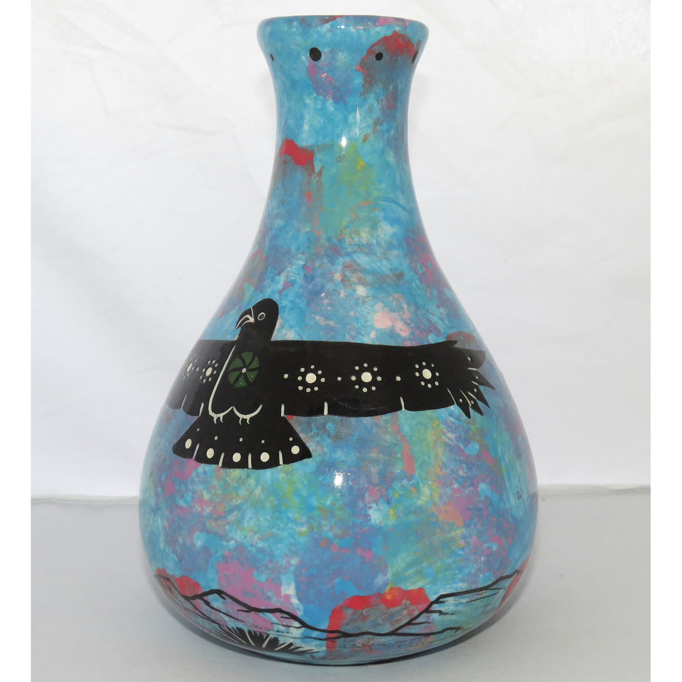 Photo of Mana Pottery Teardrop Vase featuring a hawk in flight high in the sky over the desert.
