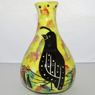 Photo of Mana Pottery Teardrop Vase featuring quail family in desert, on bright yellow background.