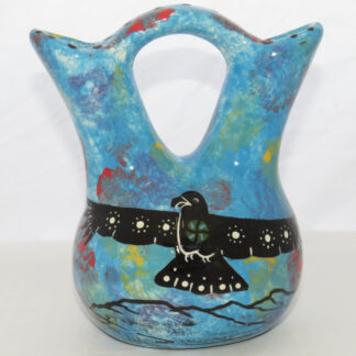 Image of Mana Pottery Tiny Wedding Vase featuring hawk in flight high in the sky on one side, and desert cactuses on reverse, all on a background of turquoise blue