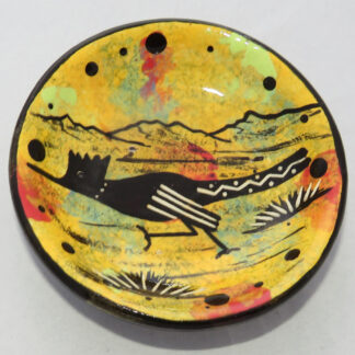 Photo of Mana Pottery Holy Bowl featuring roadrunner on golden yellow background, and black and white marbled underside.