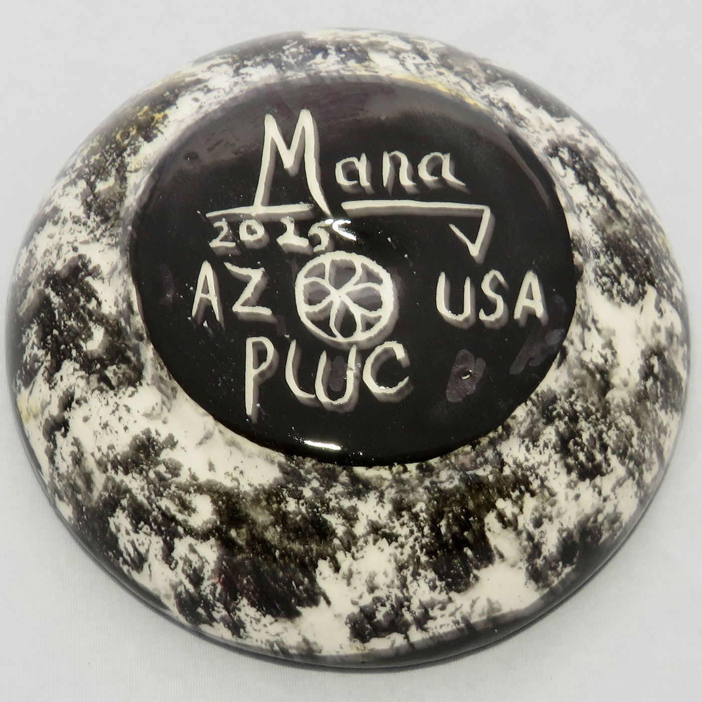 Photo of Mana Pottery Holy Bowl featuring roadrunner on golden yellow background, and black and white marbled underside.